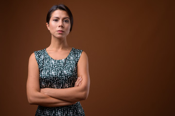 Wall Mural - Portrait of beautiful multi ethnic businesswoman with hair tied