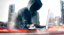 Hacker With Laptop. Computer Crime.