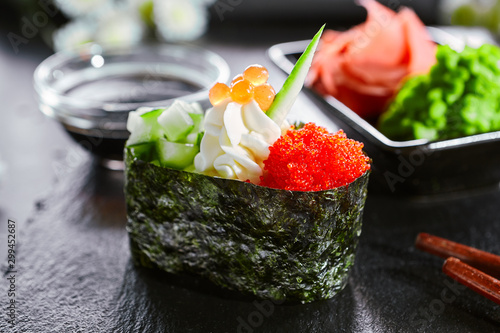 Delicious Gunkan With Cucumber And Masago Caviar Japanese Cuisine Restaurant Menu Item Traditional Eastern Dish National Cooking Tasty Sushi Oriental Food On Wooden Platter Closeup Stock Photo Adobe Stock