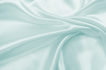 Wall Mural - Delicate satin draped fabric of blue color texture for festive backgrounds
