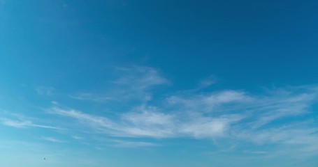 timelapse of cirrus clouds on bright blue sky