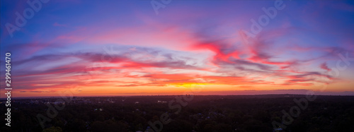 Cuadros en Lienzo Colourful cloudscape aerial sunset panorama of Sydney Western suburbs