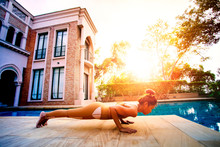 Woman Posting Plank  Yoga Pose Beside Sport Water Pool