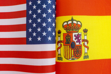 fragments of the national flags of the United States and Spain close-up concept