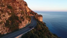 A Car Is Driving In The Beautiful Amalfi Coast In Italy During The Golden Hour