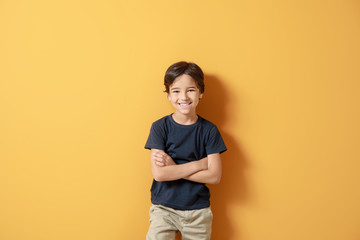 Canvas Print - Cute little boy on color background