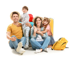 Happy Family With Suitcases Isolated On White