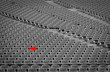 © Artinun - Football stadium with empty seats. Outstanding empty red plastic chair at soccer arena. Row of unoccupied bench at sports stadium. Reserved seating for football game concept. Outdoor audience chairs.