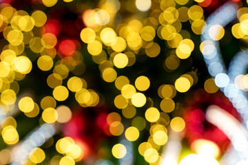 Colorful orange red bokeh background of Christmas lights and New year