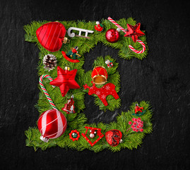 Wall Mural - Letter E made of Christmas tree ornaments