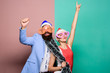 © be free - Christmas party office. Manager tinsel celebrate new year. Corporate holiday party ideas. Winter corporate party. Office christmas party. Happy man and woman wear santa hats and funny sunglasses