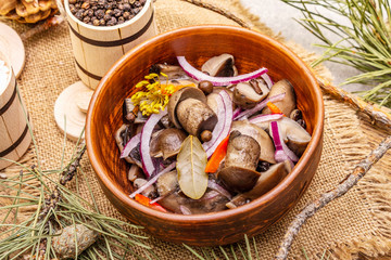 Wall Mural - Pickled (fermented) mushrooms. Traditional New Year (Christmas) snack. Festive table cutlery setting