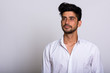 © Ranta Images - Portrait of young handsome bearded Persian businessman