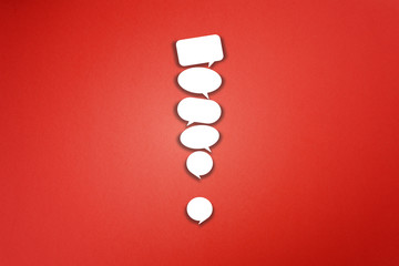 Wall Mural - Exclamation mark made from speech bubbles on red background