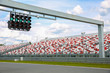 green traffic lights over the race track in summer