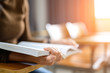 © mnirat - Students read books at the university classroom desk.