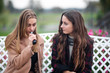 © aleksandr_yu - Bisexual relationship lesbian young caucasian teenage girls on the bench on the street in the autumn. Lesbian couple love story. LGBT community.