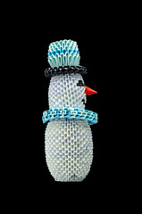 Snowman origami isolated on black background