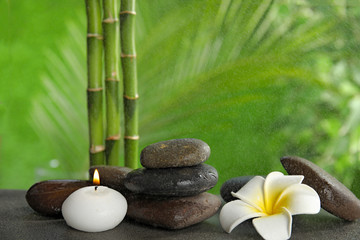 Composition with stones on table against blurred background. Zen concept