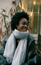 Smiling Young Woman Wearing Bulky Scarf