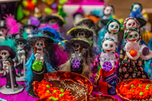 Glass And Sequin Sugar Calaveritas Dolls, Typical Sweets During The Time Of The Day Of The Dead In Mexico, Toy Offerings Made With Crumbs And Icing Sugar