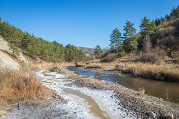 Stream with salt deposit in Salt Mountains near Praid in Transylvania, Romania