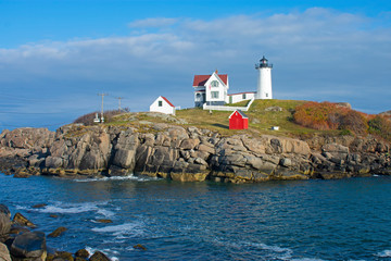 View of Nubble Lighthouse from Sohier Park, Cape Neddick, York, Maine, on a sunny day with a mostly clear, blue sky -01