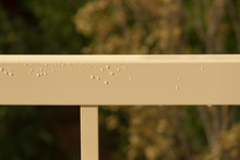 Metal Railings With Rain Drops In Sunlight