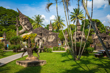 Buddha park Xieng Khouane in Vientiane, Laos. Famous travel tourist landmark of Buddhist stone statues and religious figures.