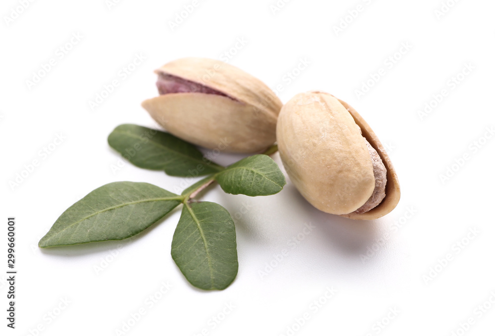 Tasty pistachio nuts on white background