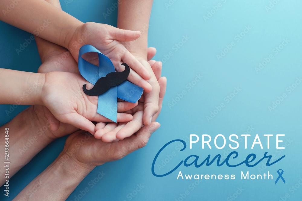 Family hands holding light blue ribbonwith mustache on blue background , Prostate Cancer Awareness, Men health awareness - obrazy, fototapety, plakaty 