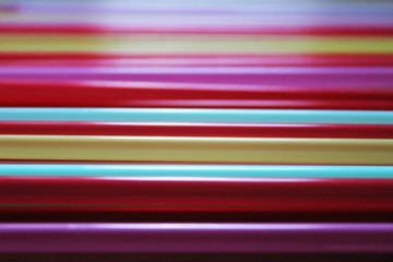 Background texture of folded multicolored tubes.