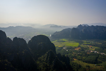 Wall Mural - Aerial view of beautiful landscapes at Vang Vieng , Laos. Southeast Asia. Photo made by drone from above. Bird eye view.