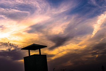 Wall Mural - sunset at the beach clouds on the red sky