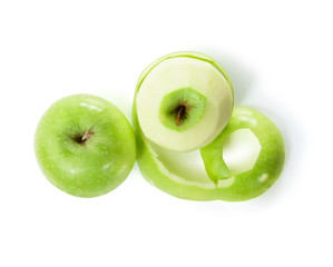 Two green apples with peeled skin isolated on white background. Top view