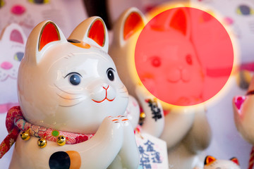 Wall Mural - Japanese lucky cat made a greeting card with the red sun as a symbol (subtitle: Lucky Cat, Jin Yun Laifu)