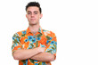 Studio shot of young handsome tourist man ready for vacation
