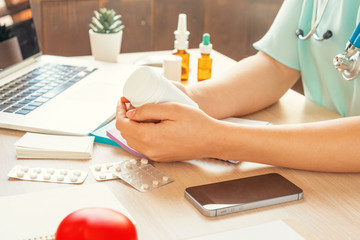 Canvas Print - Female medicine doctor filling patient medical form or prescription