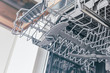 © vladdeep - Shelf with nozzles in the dishwasher.