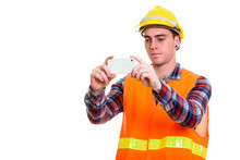 Portrait Of Young Handsome Man Construction Worker Taking Picture With Phone