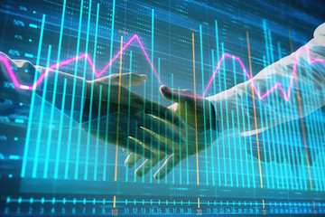 Multi exposure of forex graph on abstract background with two businessmen handshake. Concept of success on stock market