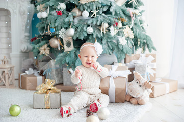 beautiful girl near decorated christmas tree