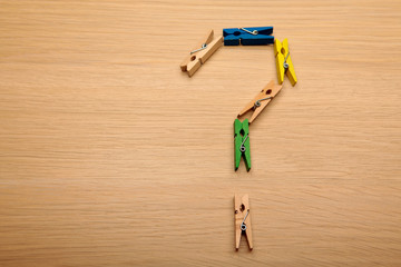 clothespin question mark wooden table background