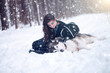 © Alik Mulikov - Fairy tale girl embracing cute dog in winter park.