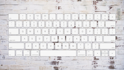 english computer keyboard layout on brick background