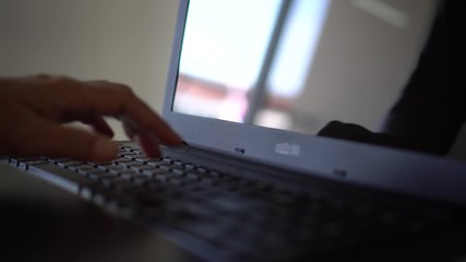 Wall Mural - Black hands of anonymous hackers  typing code on keyboard of laptop for remotely reach, receiving personal information online, Networking Crime Payment Security Concept