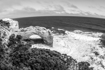 Poster - Black and white seaside view from Great ocean road, Natural Arch in Port Campbell National Park, Victoria, Australia