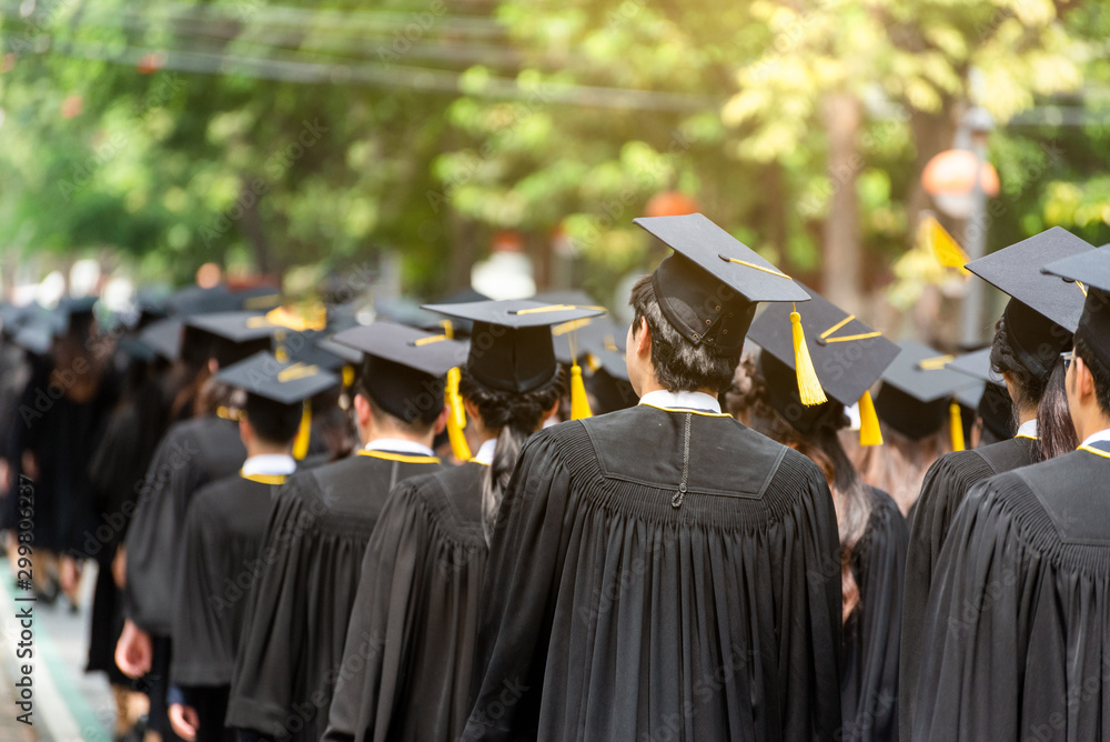 Back side view a group higher education graduation of graduates during ...