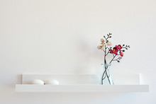 Composition Of Dried Flowers On White Wall Background.