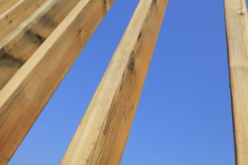 Stakes in blue sky background